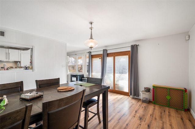 dining room with visible vents and light wood-style floors