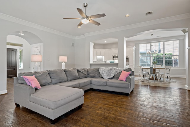 living room with baseboards, visible vents, recessed lighting, dark wood-style flooring, and ornamental molding