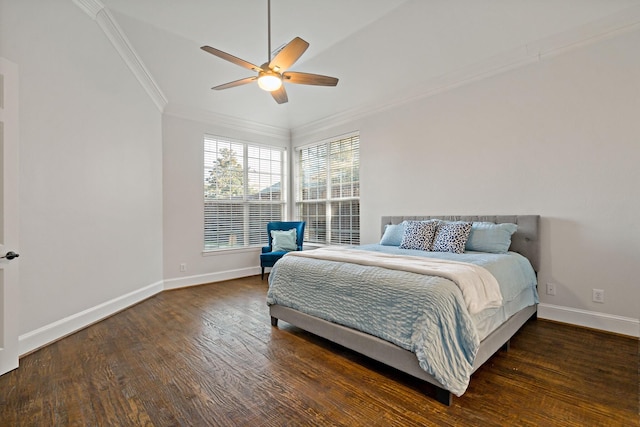 bedroom with a ceiling fan, crown molding, baseboards, and wood finished floors