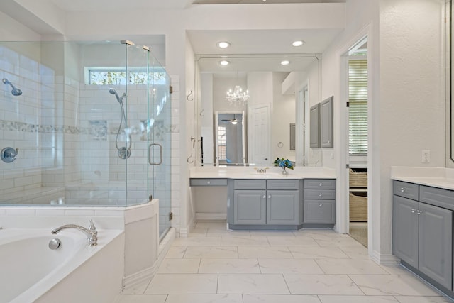 full bath featuring vanity, marble finish floor, a bath, and a shower stall