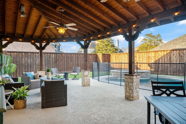 view of patio / terrace with a ceiling fan, a gazebo, a fenced backyard, and a fenced in pool