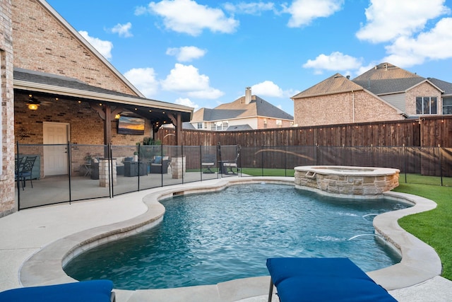 view of swimming pool with a patio, a fenced backyard, and a pool with connected hot tub