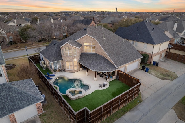 aerial view at dusk with a residential view