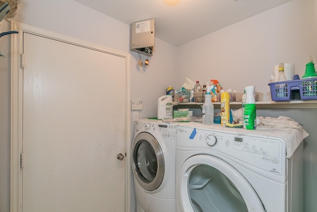 washroom featuring separate washer and dryer and laundry area