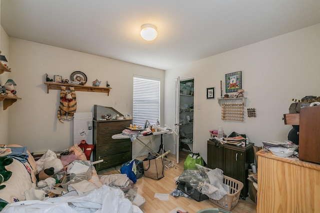 bedroom featuring wood finished floors