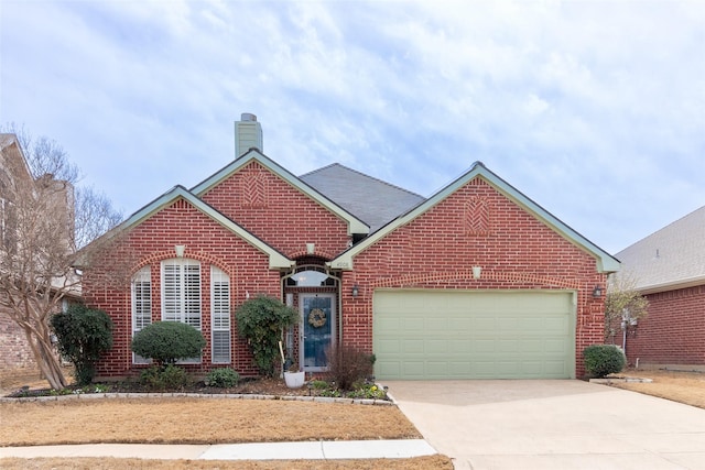 single story home with brick siding, an attached garage, concrete driveway, and a chimney