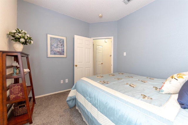 carpeted bedroom with baseboards