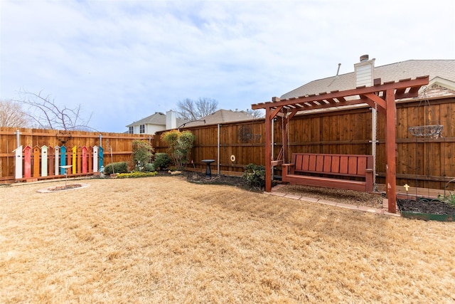 view of yard featuring a pergola and a fenced backyard