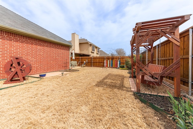 view of yard with a fenced backyard and a pergola