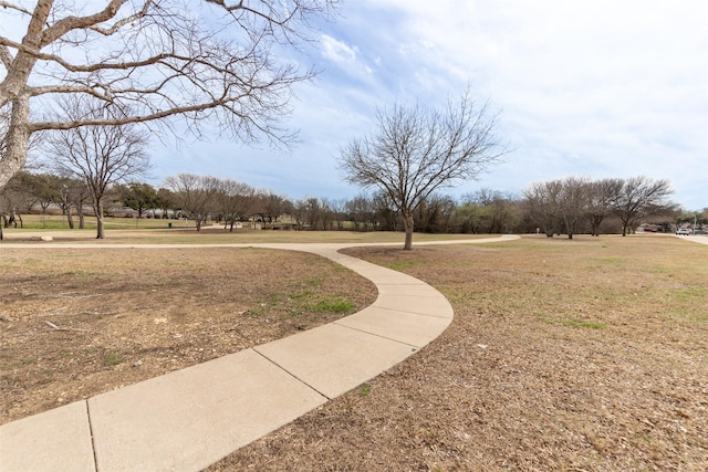 view of property's community featuring a yard