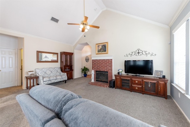 living room with carpet flooring, a brick fireplace, crown molding, and visible vents