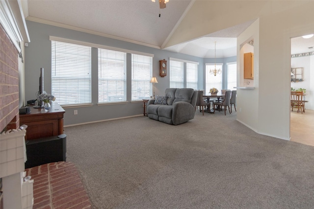 living area with carpet flooring, high vaulted ceiling, crown molding, and baseboards