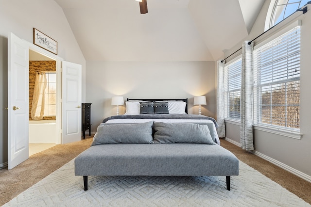 bedroom with lofted ceiling, ensuite bathroom, a ceiling fan, carpet, and baseboards