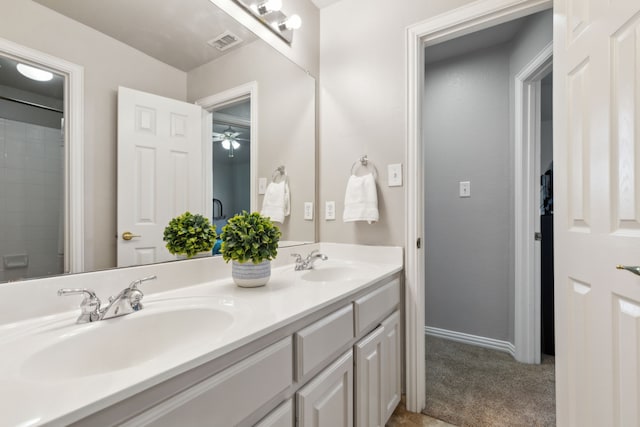 full bathroom with double vanity, visible vents, and a sink