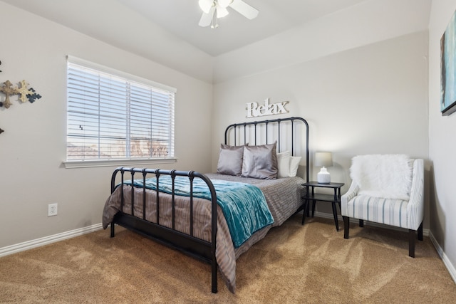 carpeted bedroom featuring ceiling fan and baseboards