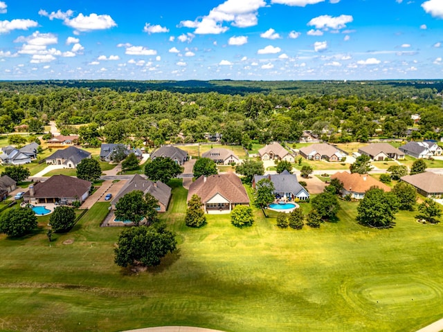 aerial view with a residential view and a view of trees