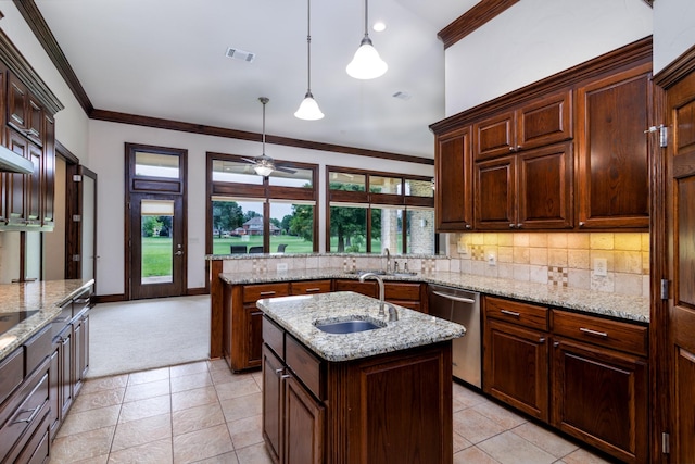 kitchen featuring visible vents, a sink, dishwasher, crown molding, and tasteful backsplash