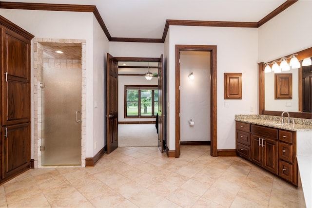 full bathroom featuring a stall shower, baseboards, and ornamental molding