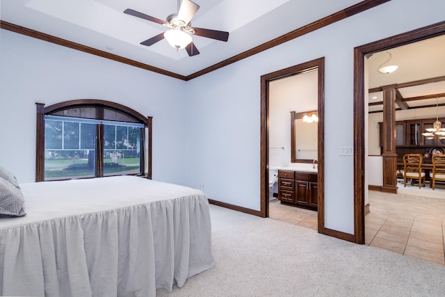 bedroom with ensuite bathroom, crown molding, light tile patterned floors, baseboards, and light colored carpet