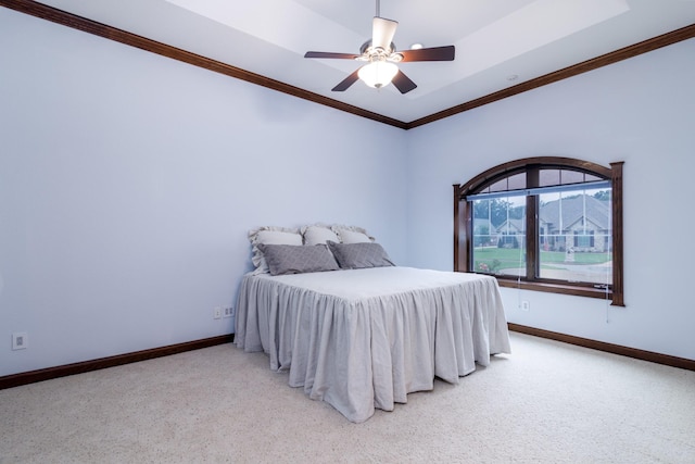 bedroom with ceiling fan, baseboards, carpet, and ornamental molding