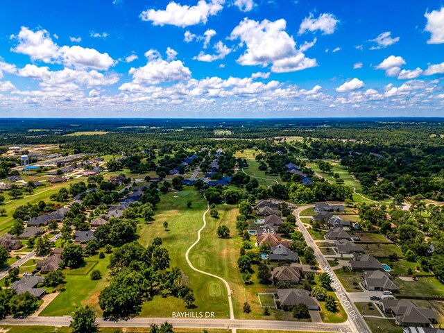 birds eye view of property with a residential view and view of golf course