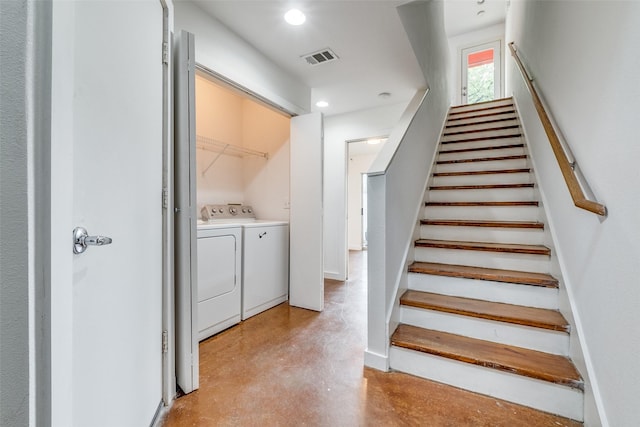 staircase with recessed lighting, visible vents, independent washer and dryer, and finished concrete flooring