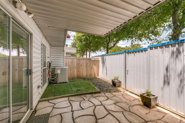 view of patio / terrace with a fenced backyard and central AC