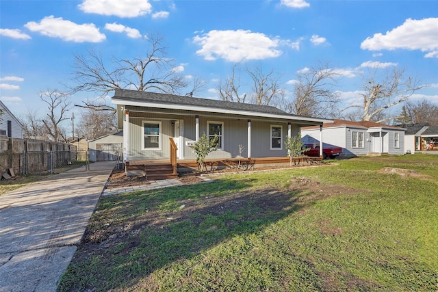 view of front of house featuring a gate, covered porch, a front lawn, and fence