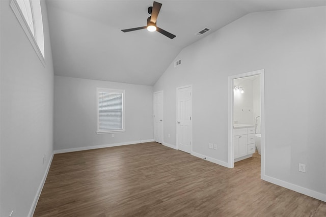 unfurnished bedroom with visible vents, baseboards, and wood finished floors