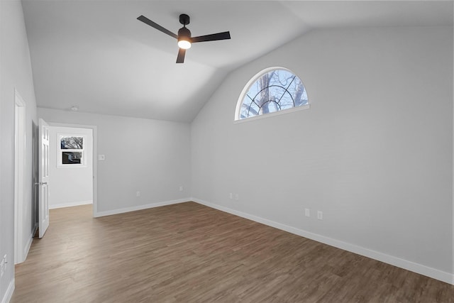 bonus room with a ceiling fan, lofted ceiling, wood finished floors, and baseboards