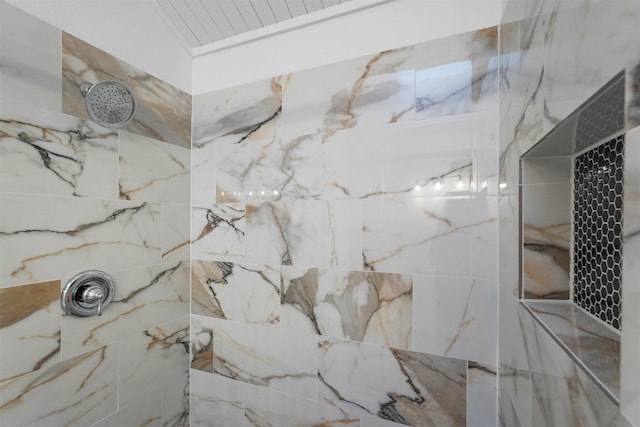 full bath with a marble finish shower