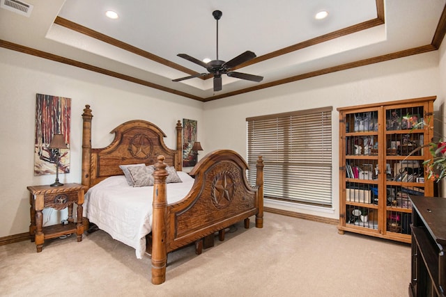 bedroom featuring visible vents, crown molding, baseboards, light colored carpet, and a raised ceiling