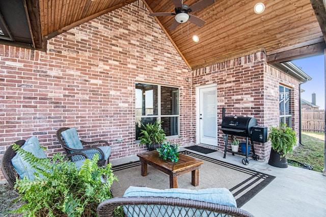 view of patio with a grill, ceiling fan, and fence