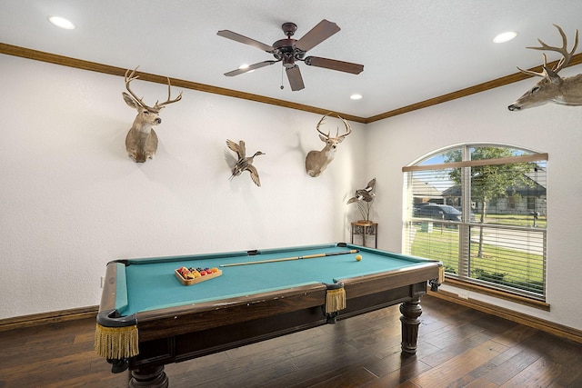 rec room featuring a ceiling fan, hardwood / wood-style flooring, crown molding, and baseboards