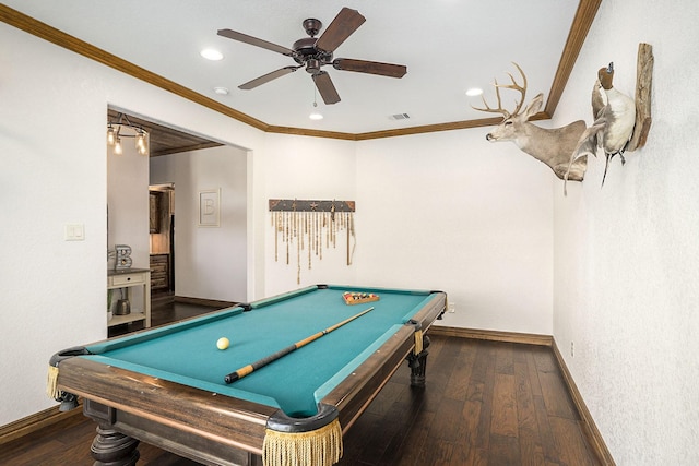 recreation room with hardwood / wood-style floors, baseboards, visible vents, and ornamental molding