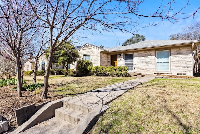 ranch-style house with stone siding and a front lawn