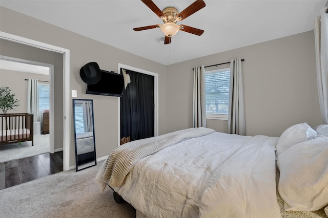 bedroom featuring carpet flooring, a ceiling fan, and baseboards