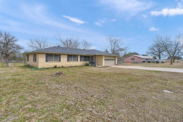 ranch-style home with a front yard, brick siding, a garage, and driveway