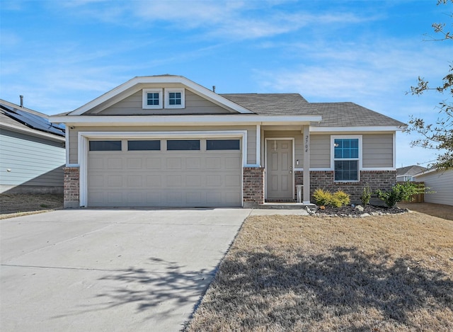 view of front of property with brick siding, concrete driveway, an attached garage, and a shingled roof