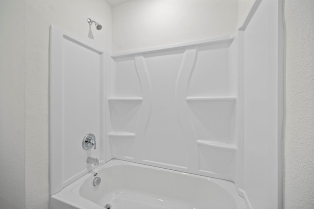 bathroom with shower / tub combination