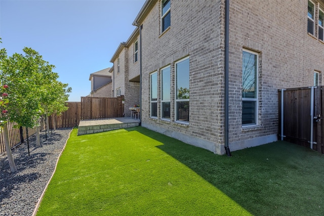 view of yard featuring a patio and a fenced backyard