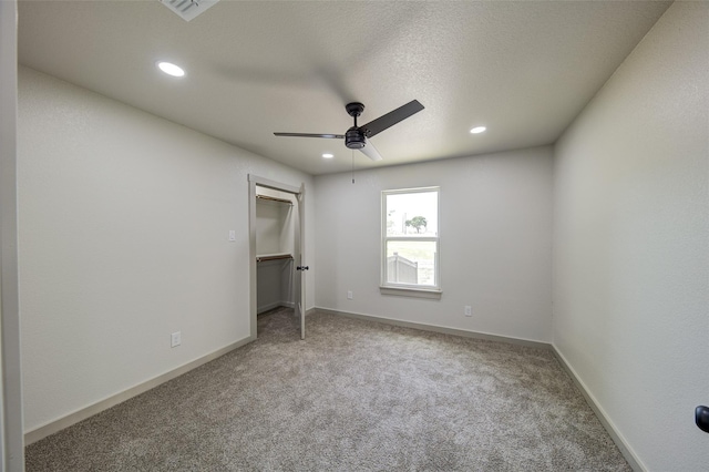 unfurnished bedroom featuring recessed lighting, baseboards, and carpet floors