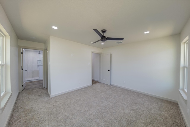 unfurnished bedroom with recessed lighting, baseboards, visible vents, and light carpet