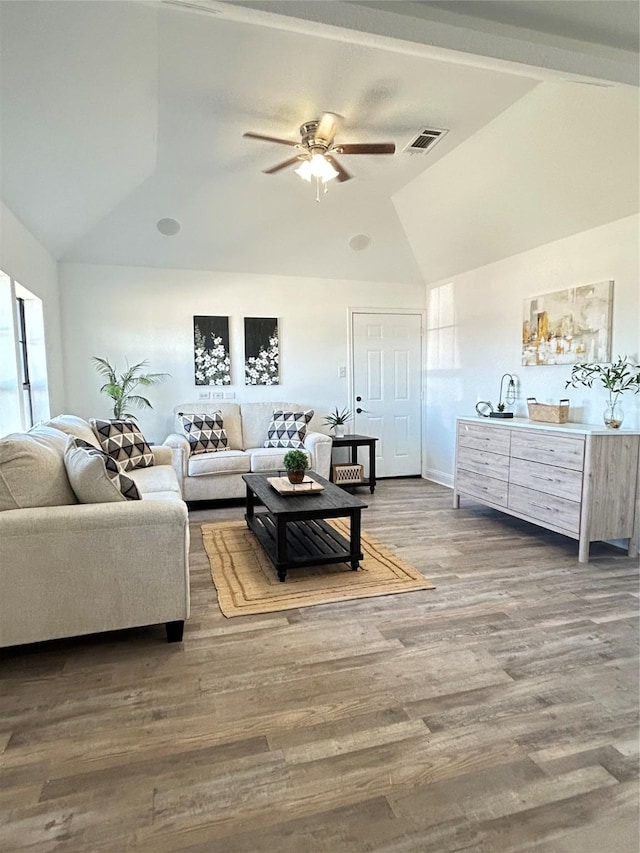 living room with visible vents, high vaulted ceiling, ceiling fan, and wood finished floors