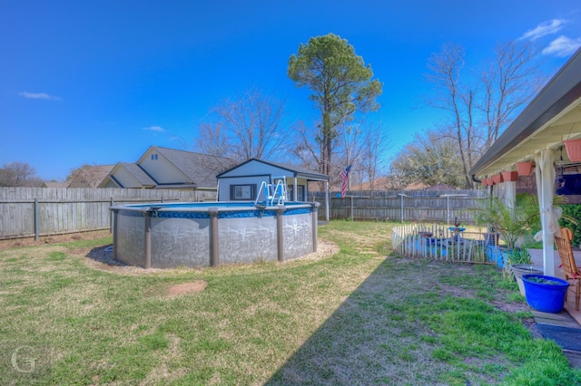 view of yard featuring a fenced in pool and a fenced backyard