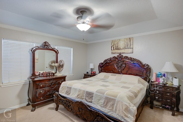 bedroom featuring baseboards, carpet floors, ceiling fan, and ornamental molding