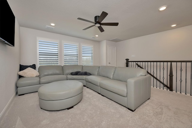 living area featuring carpet flooring, recessed lighting, baseboards, and visible vents