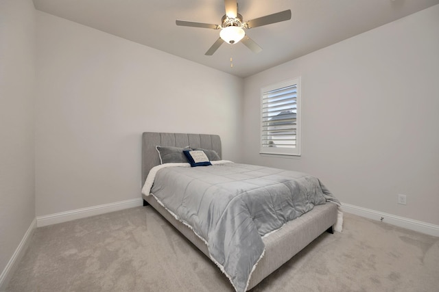 carpeted bedroom with baseboards and ceiling fan