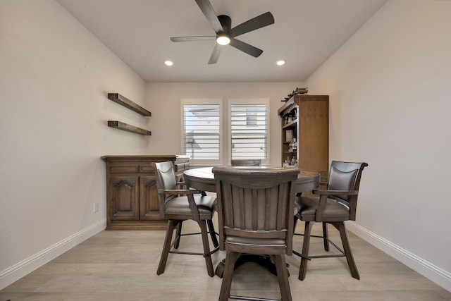 dining area featuring recessed lighting, baseboards, and light wood-style floors