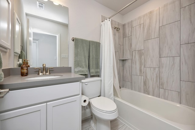 full bathroom with visible vents, shower / bath combination with curtain, toilet, and vanity